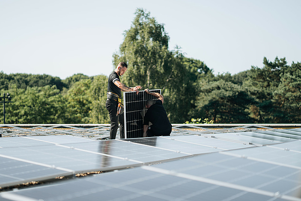 Solar panels being installed on a roof